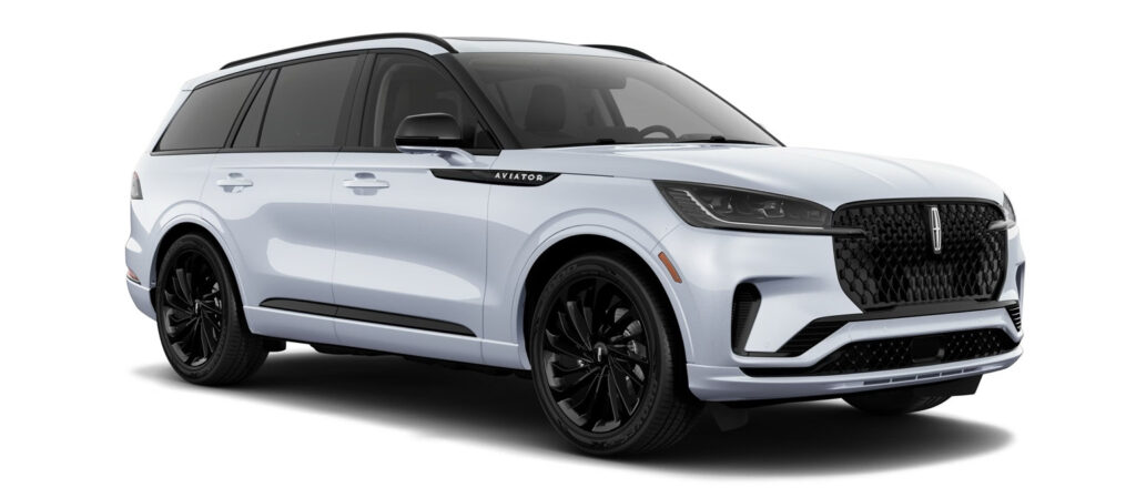 White SUV with sleek design, black grille, and tinted windows, branded "Aviator" on the side.