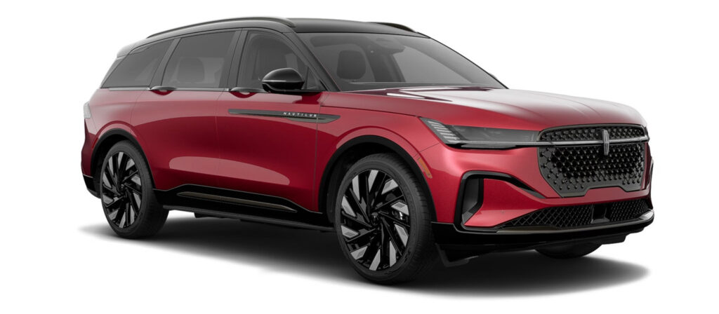 Red luxury SUV with sleek design, black grille, and distinctive alloy wheels.